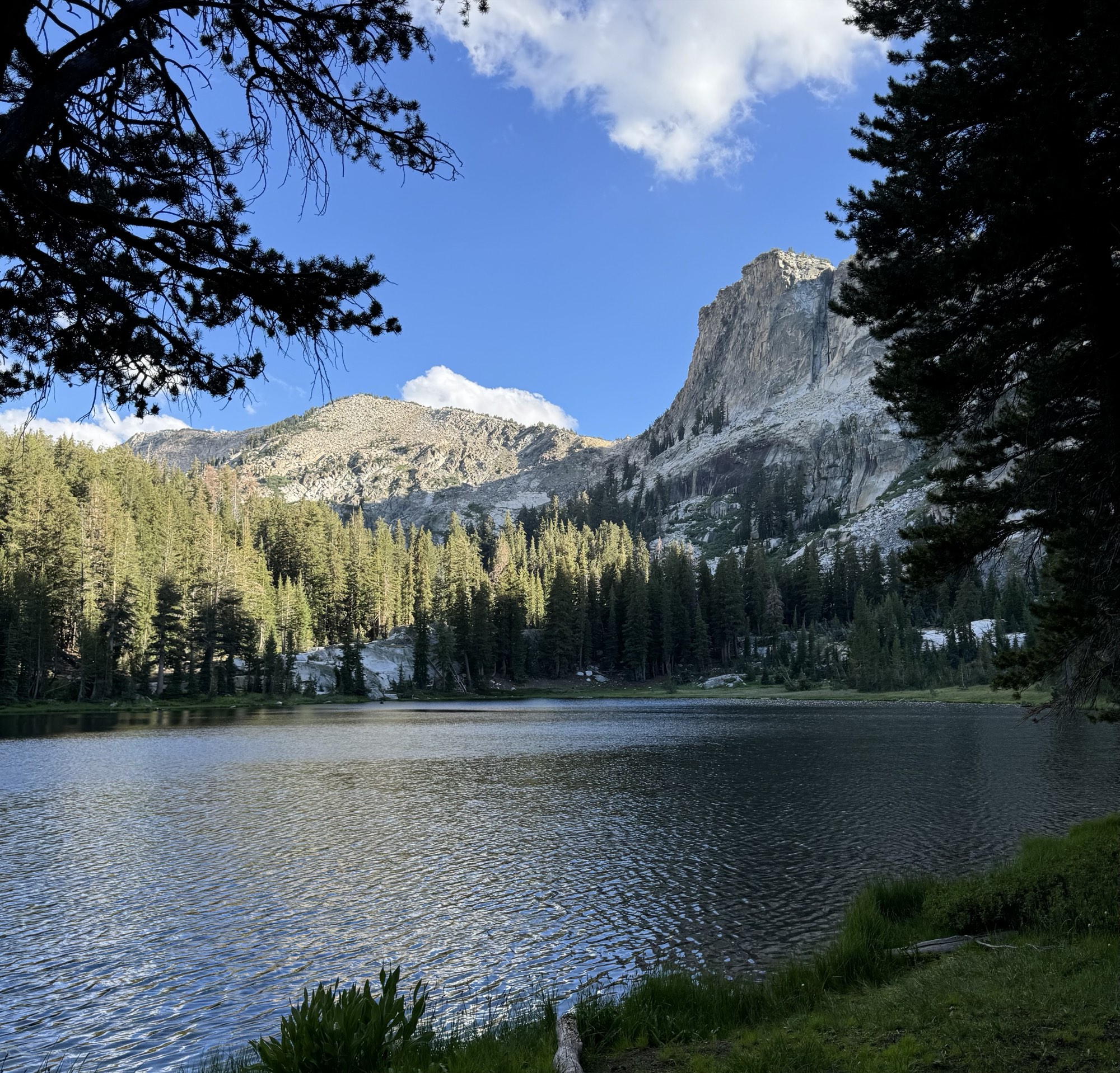 Evening light on a granite peak above a Ten Lakes basin lake